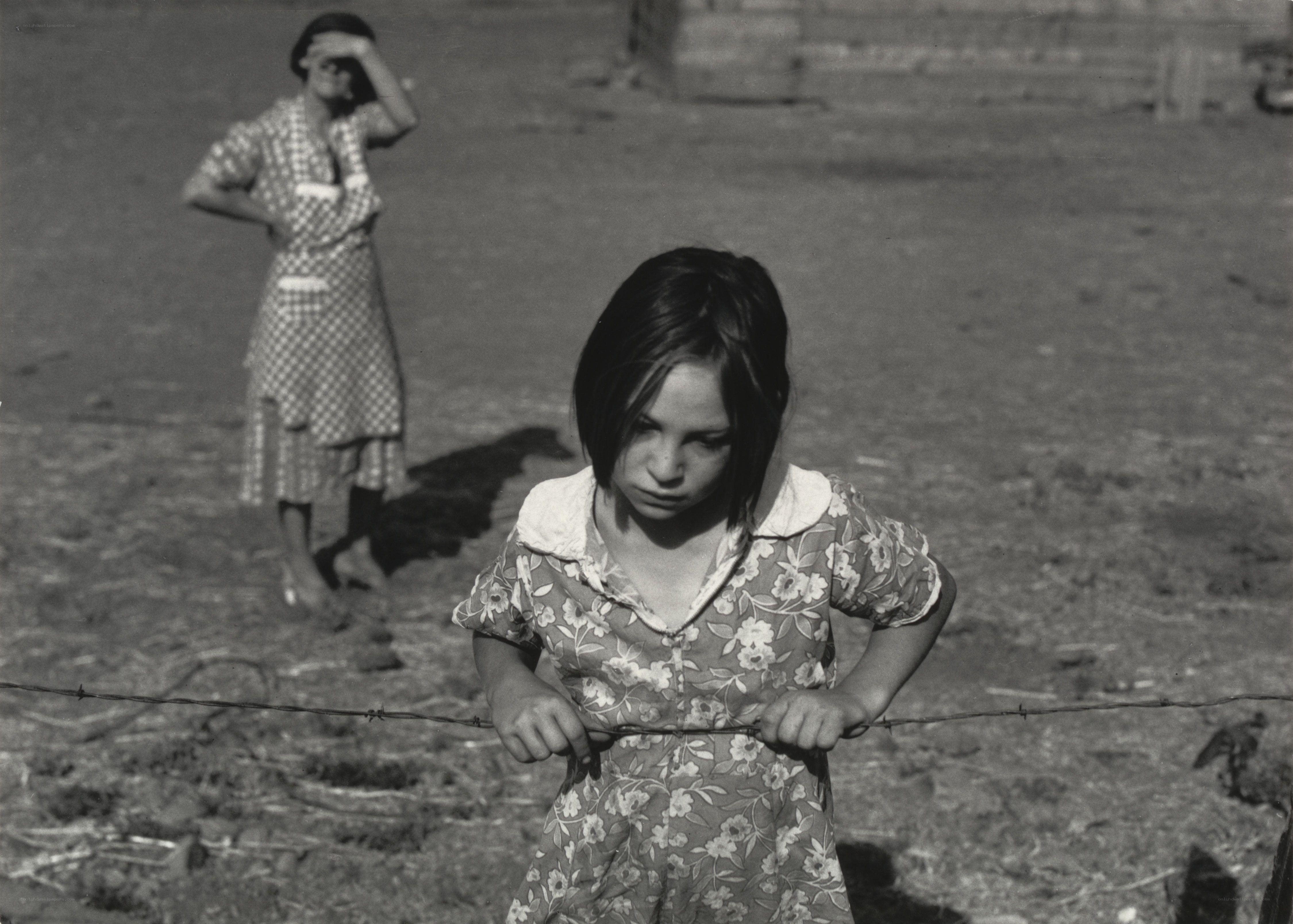 Girl holding barbed wire
