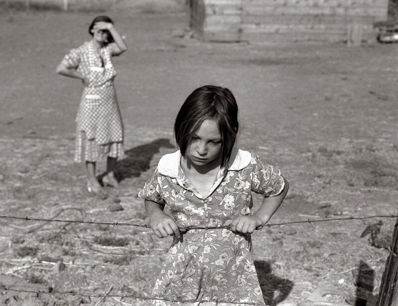 Girl holding barbed wire