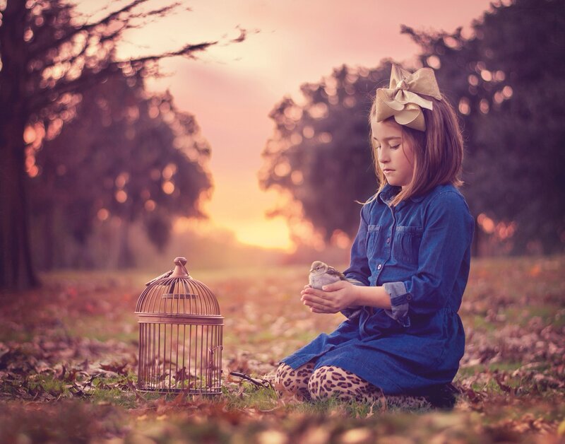 Girl Holding Bird — Blue