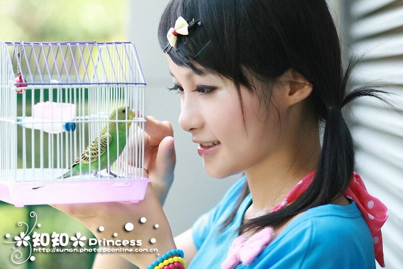 Girl Holding Birdcage — Blue, Calm