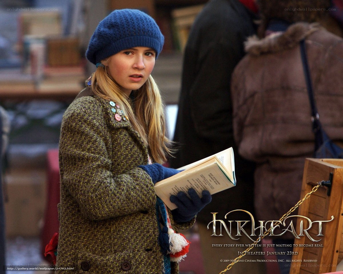 girl holding book in winter