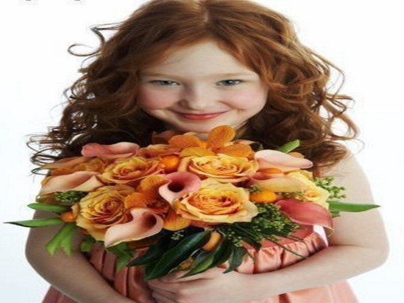 girl holding bouquet of flowers