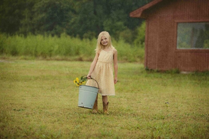 Girl Holding Bucket