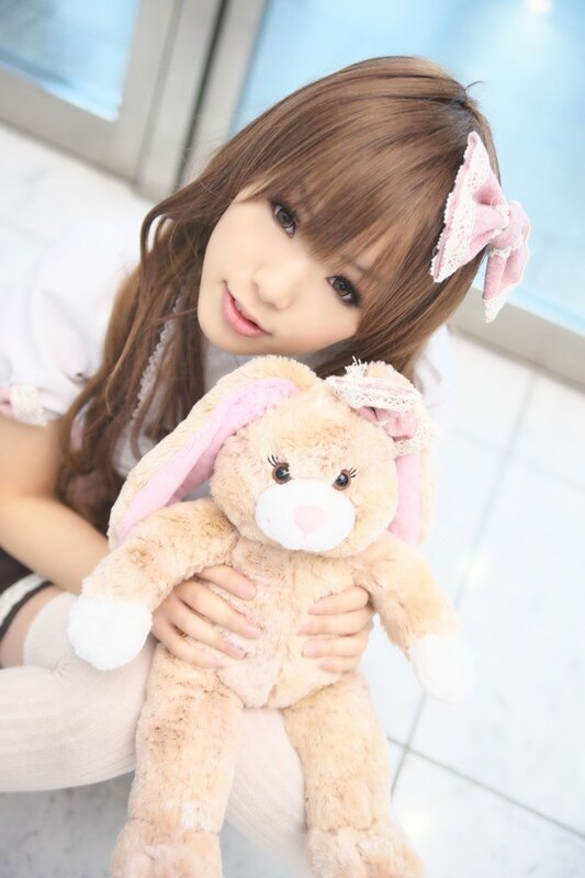 girl holding bunny plush