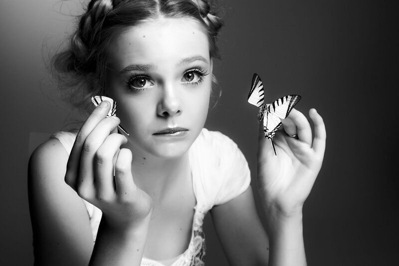 Girl Holding Butterflies
