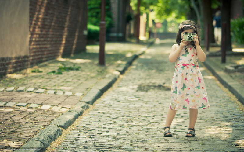 Girl Holding Camera — Green, Serene