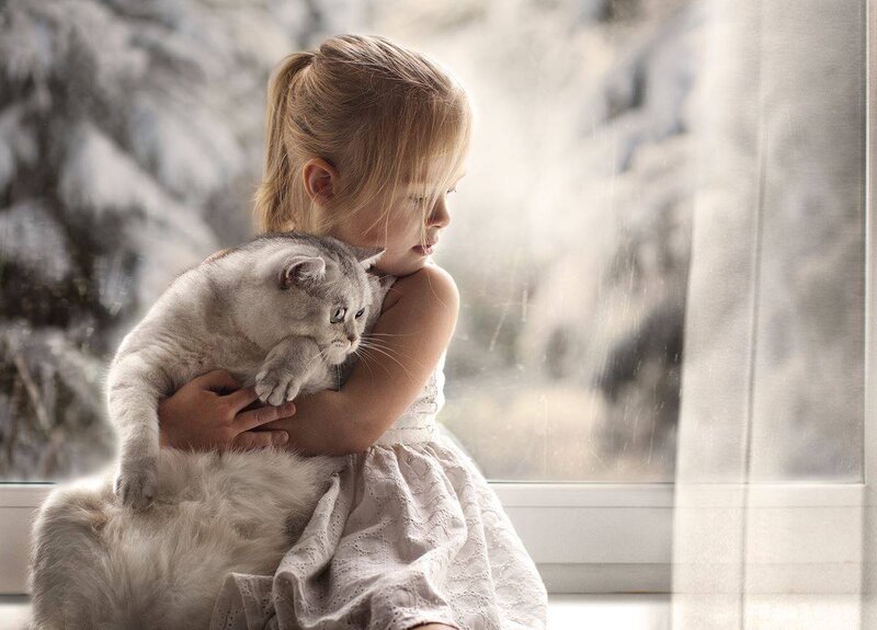 Girl Holding Cat — White, Serene, Winter
