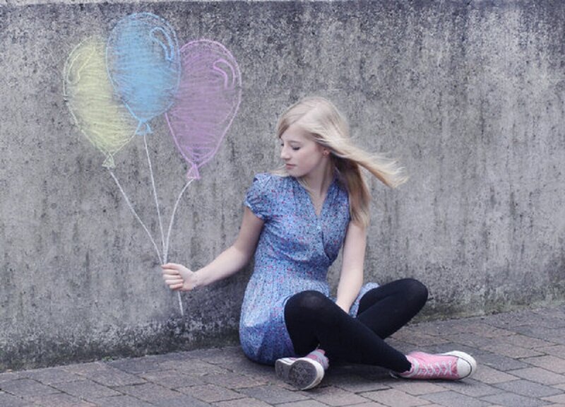 Girl Holding Chalk Balloons