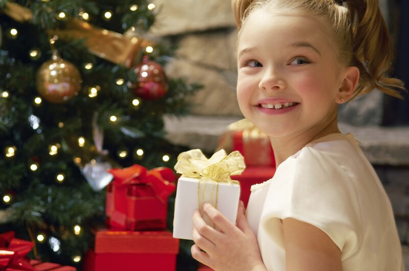 girl holding christmas gift