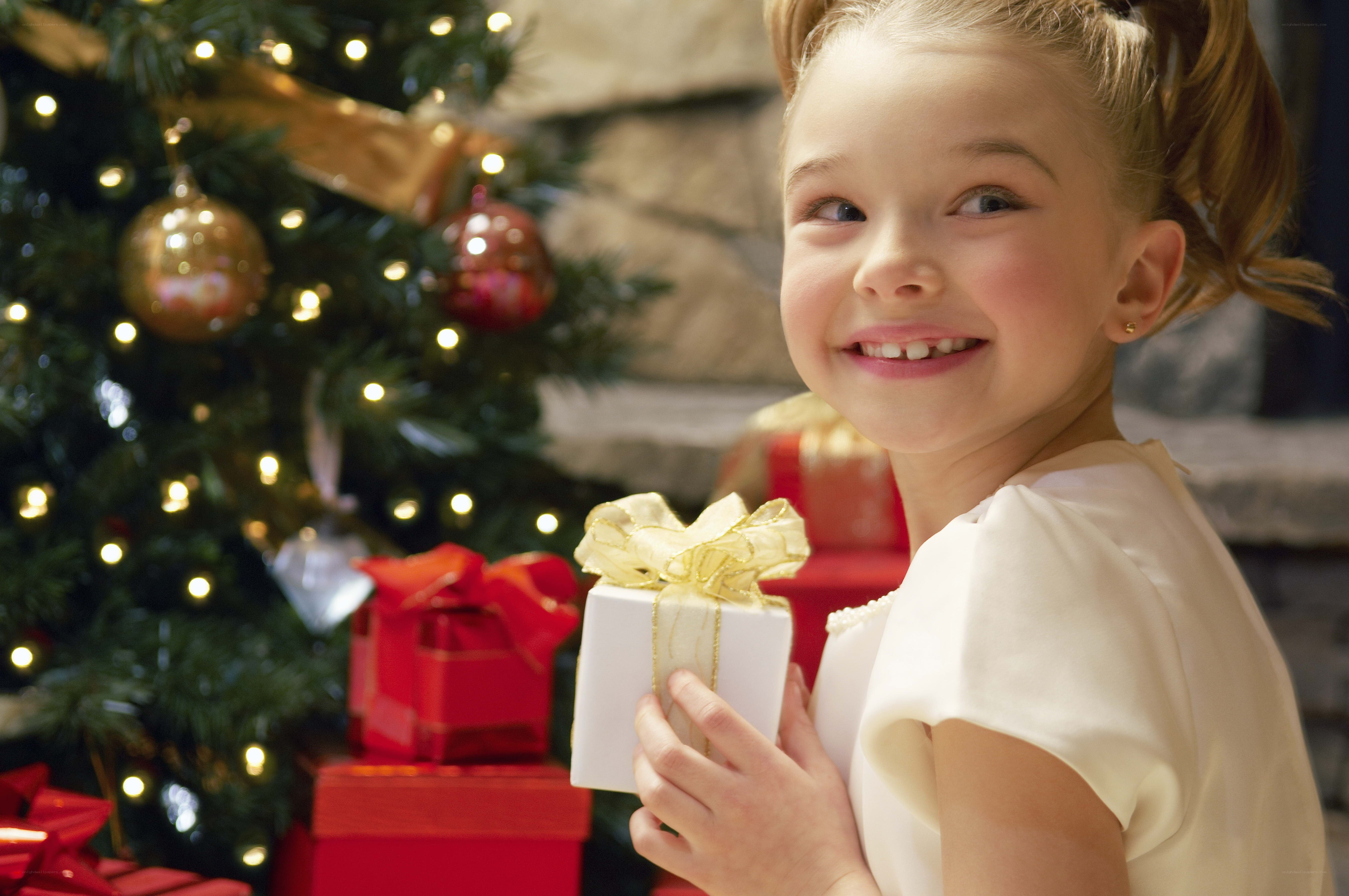girl holding christmas gift
