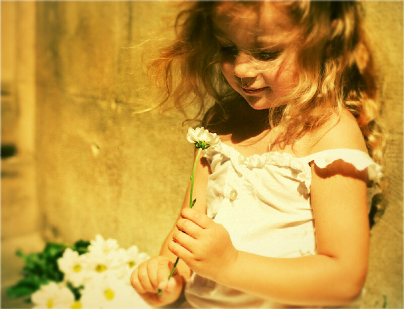 Girl Holding Daisy
