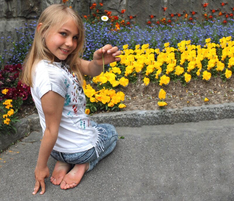 Girl Holding Daisy — Yellow, Cheerful