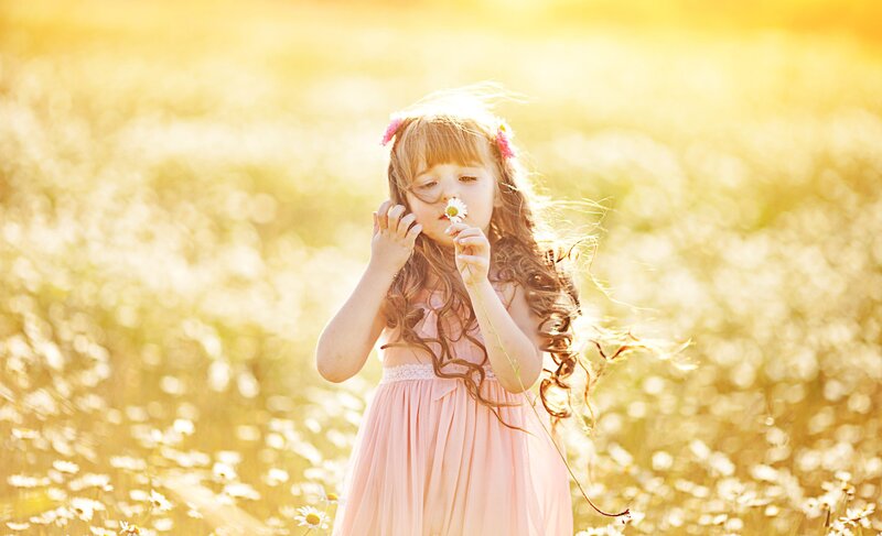 Girl Holding Daisy — Yellow