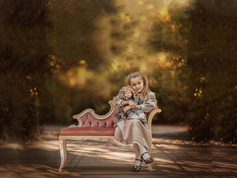 Girl Holding Doll — Brown, Serene