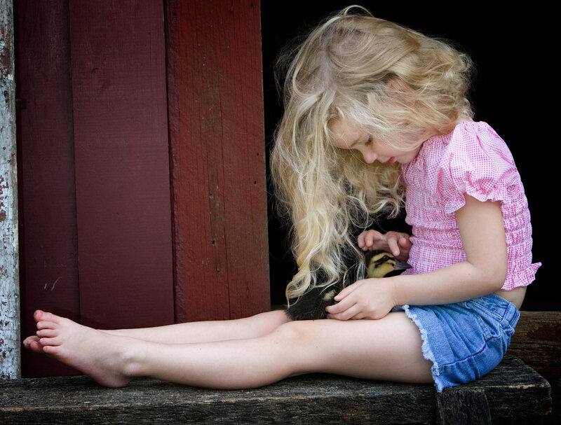 Girl Holding Duckling