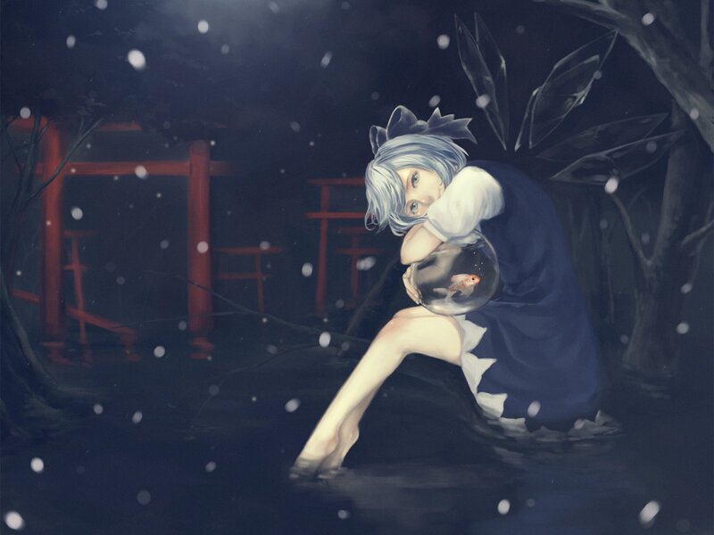 Girl holding fishbowl in snow