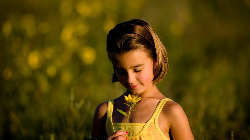Girl Holding Flower — Yellow, Serene