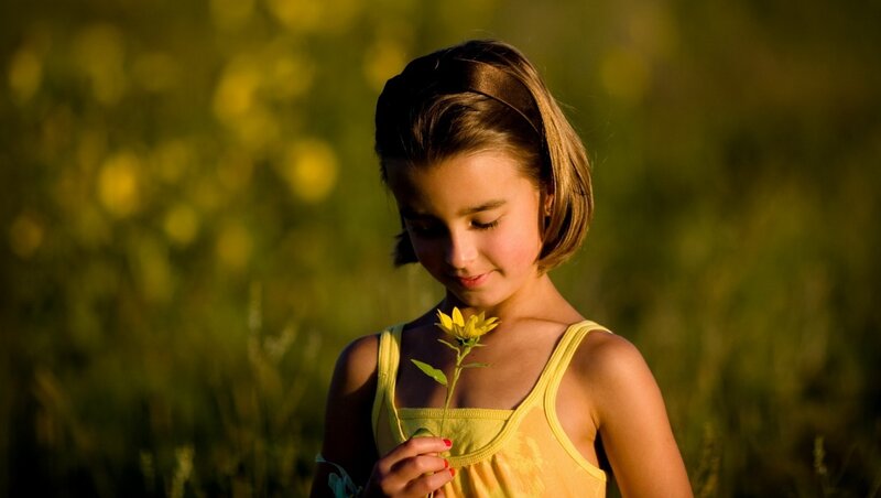Girl Holding Flower — Yellow
