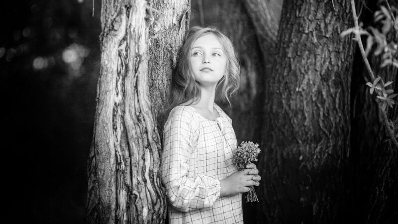 Girl Holding Flowers — Black, Serene