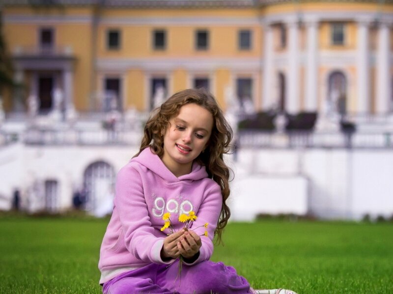 Girl Holding Flowers — Purple