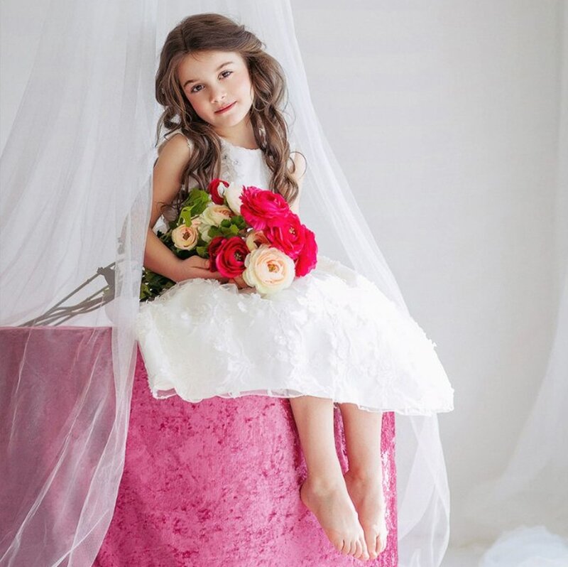 Girl Holding Flowers — White, Serene, Photograph, Veil