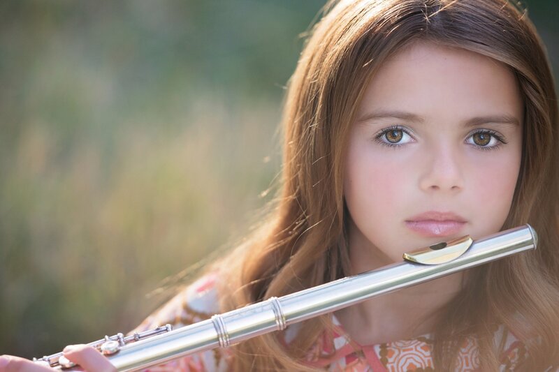 Girl Holding Flute — Brown