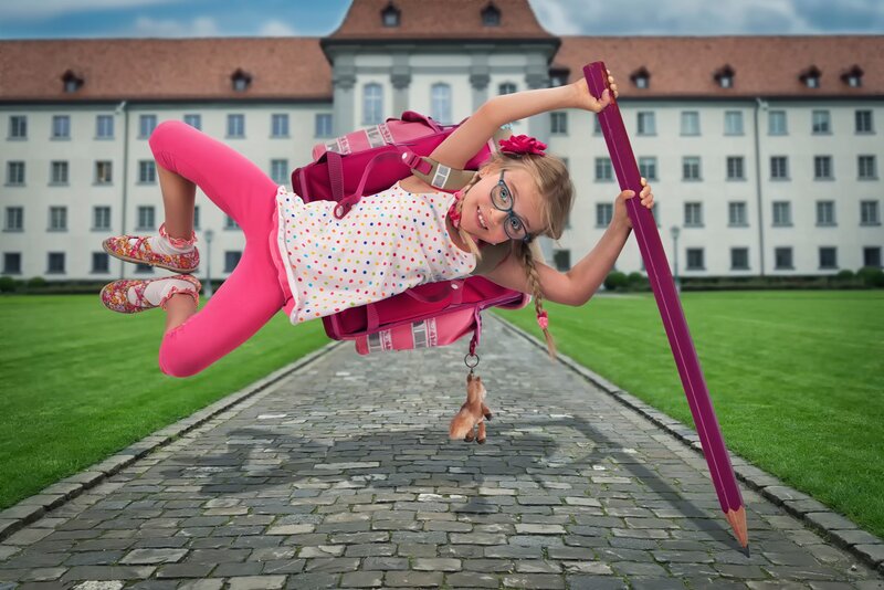 Girl Holding Giant Pencil