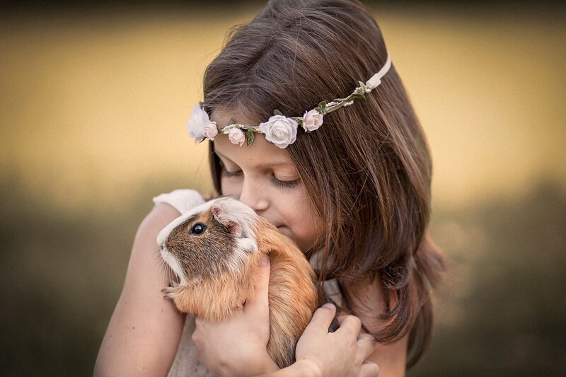 Girl Holding Guinea Pig