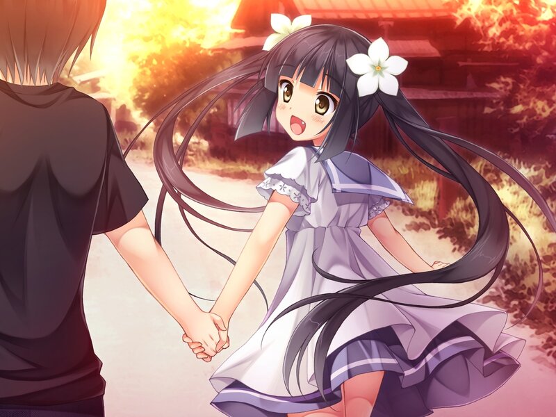 girl holding hands at sunset