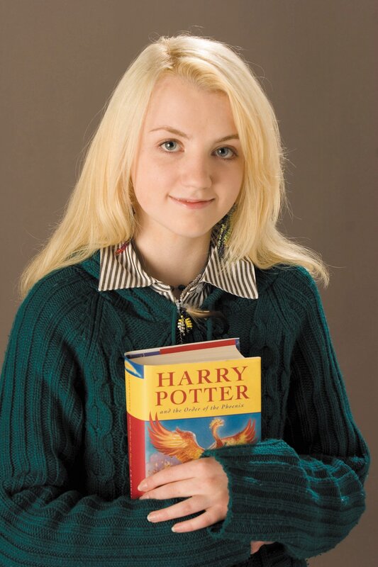 Girl holding Harry Potter book