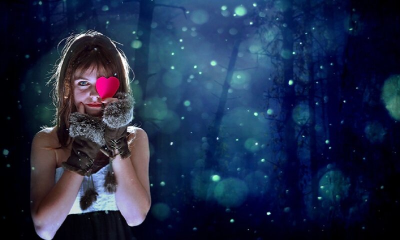 Girl Holding Heart in Forest