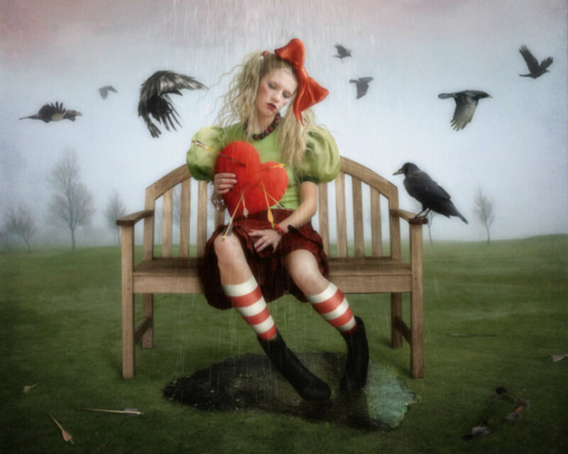 Girl Holding Heart on Bench