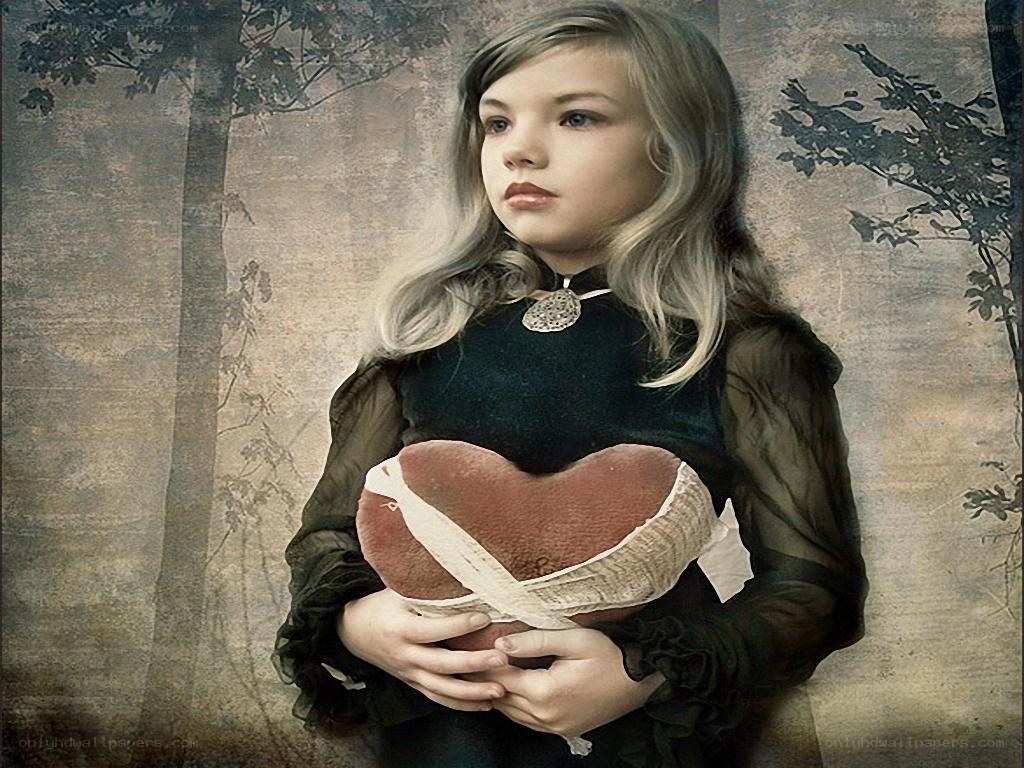 girl holding heart pillow