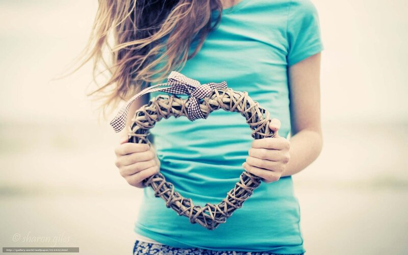 Girl holding heart wreath