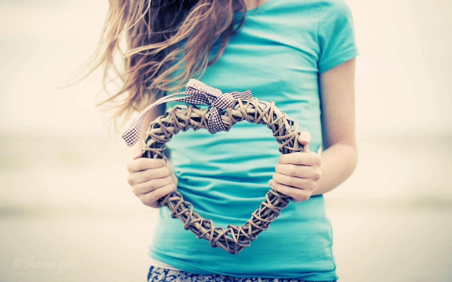 Girl holding heart wreath