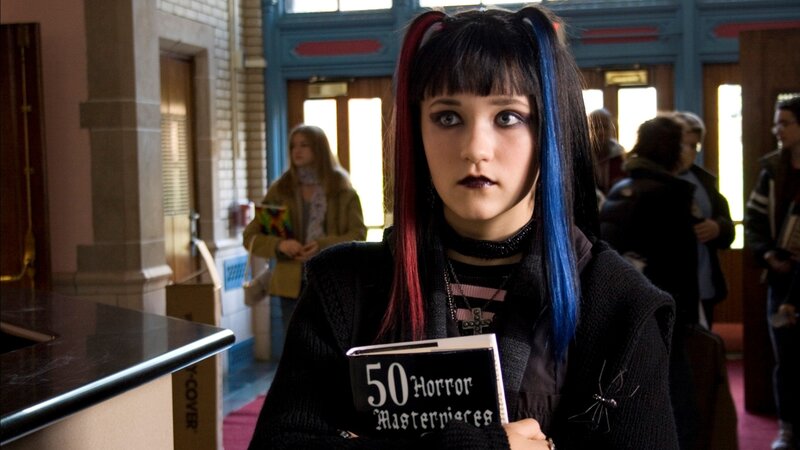 girl holding horror book