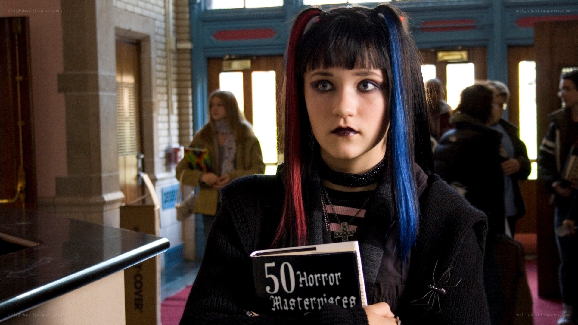 girl holding horror book
