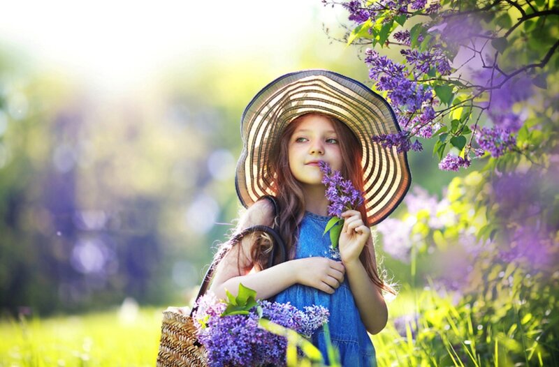 Girl Holding Lilac Flowers