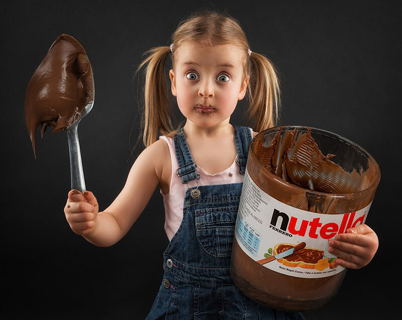 Girl Holding Nutella Jar