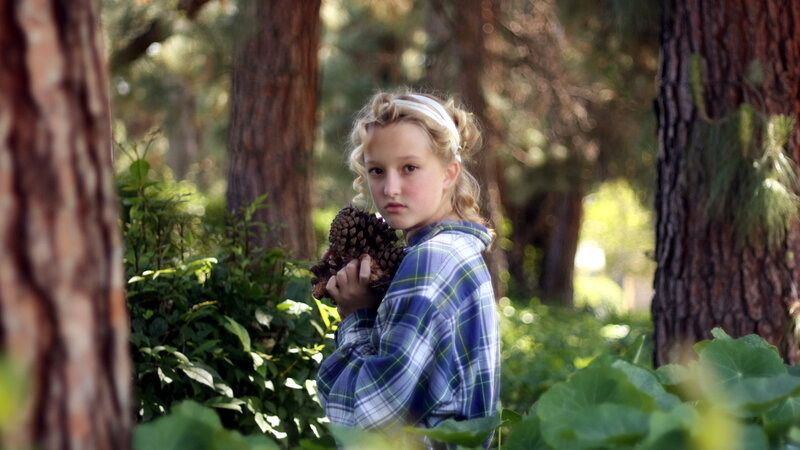 Girl Holding Pinecone