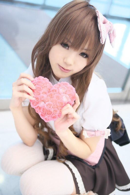 girl holding pink rose heart