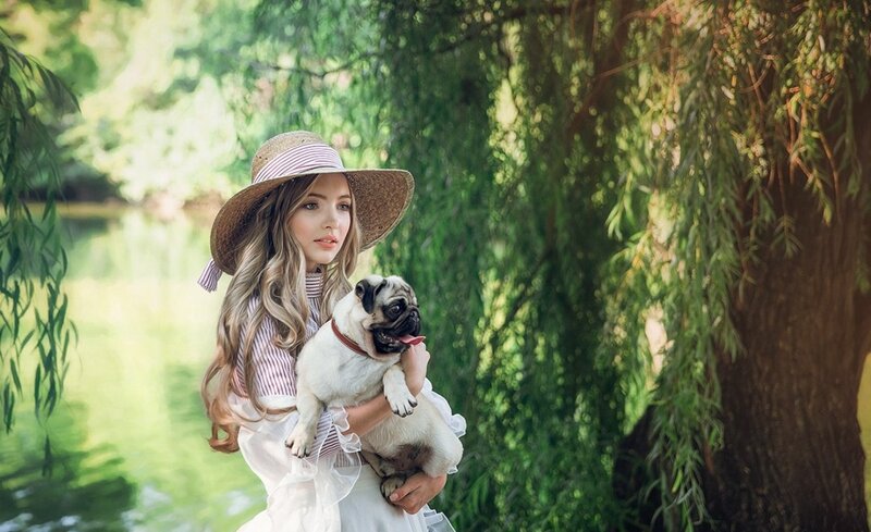 Girl Holding Pug Dog