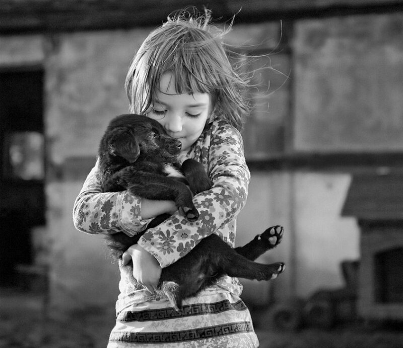 Girl Holding Puppy — Black