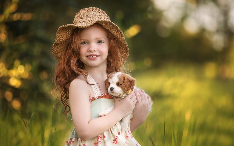 Girl Holding Puppy — Green, Serene, Afternoon, Photograph, Straw Hat