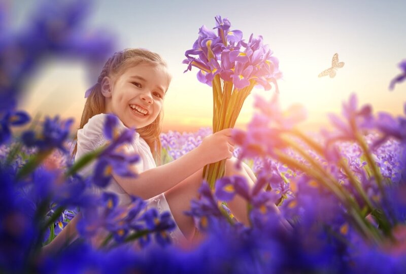 Girl Holding Purple Flowers — Serene