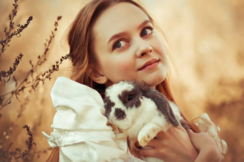 Girl Holding Rabbit — Brown, Serene