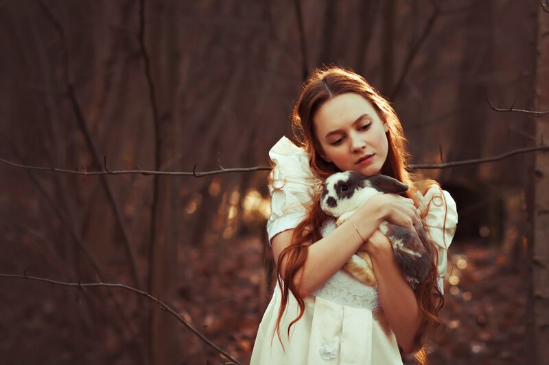 Girl Holding Rabbit — Brown