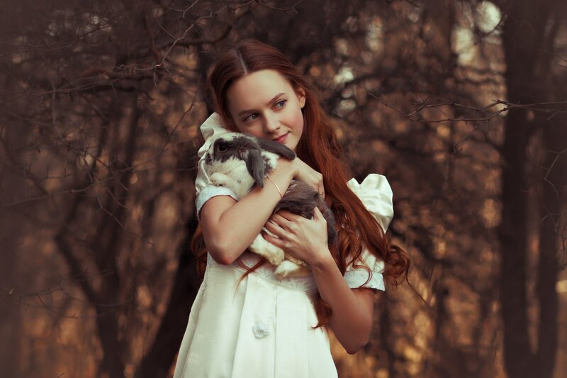 Girl Holding Rabbit — White, Serene, Autumn