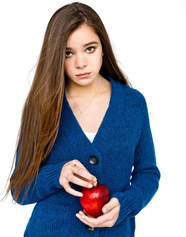girl holding red apple