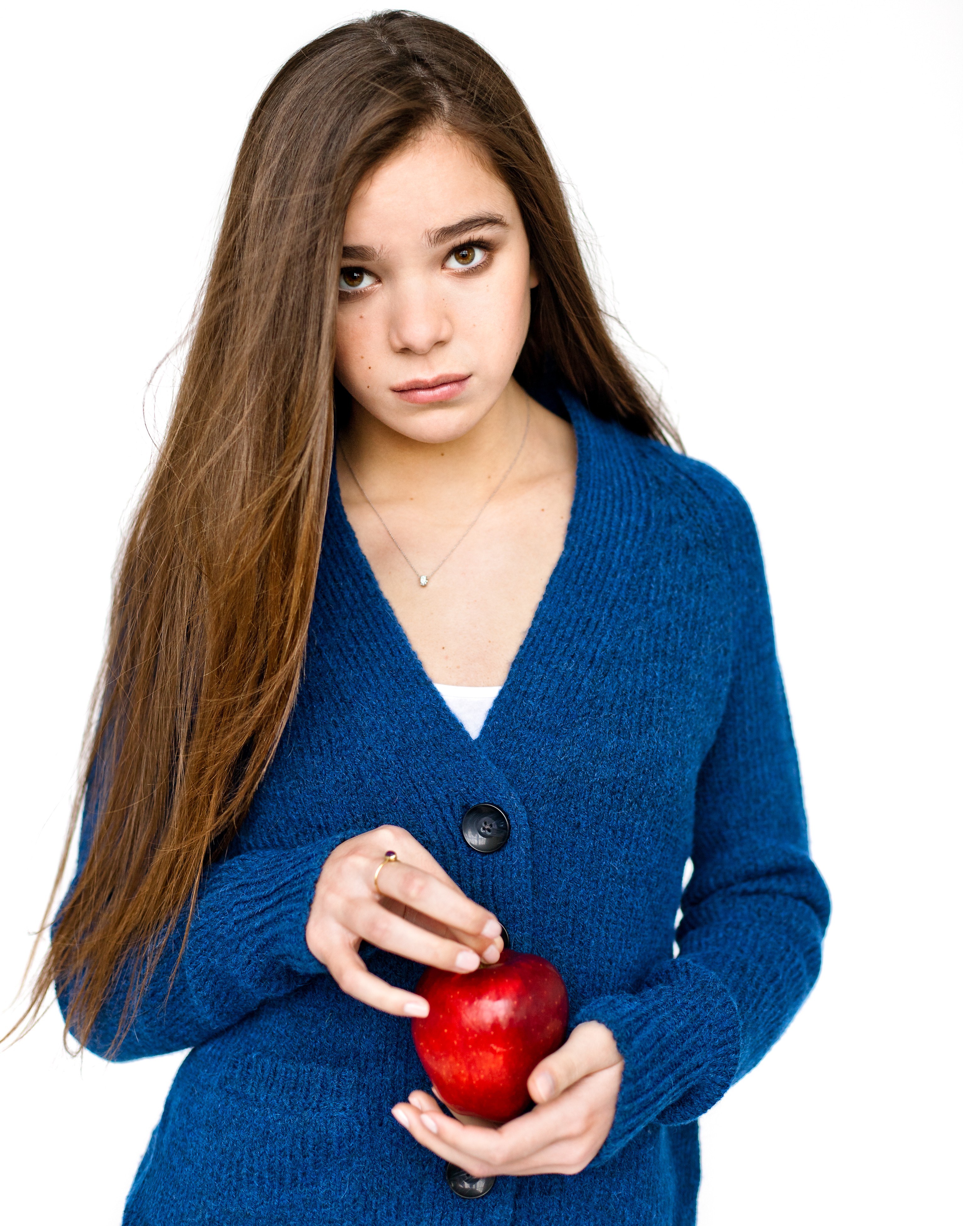 girl holding red apple